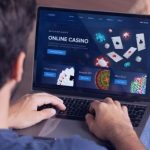 Man play online casino on laptop